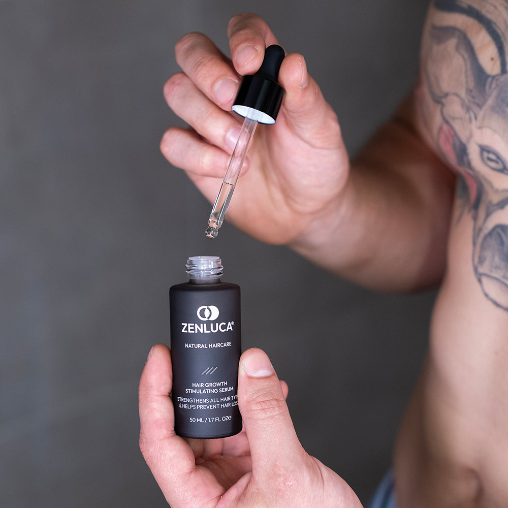 Person applying ZENLUCA Hair Growth Stimulating Serum with a precision dropper